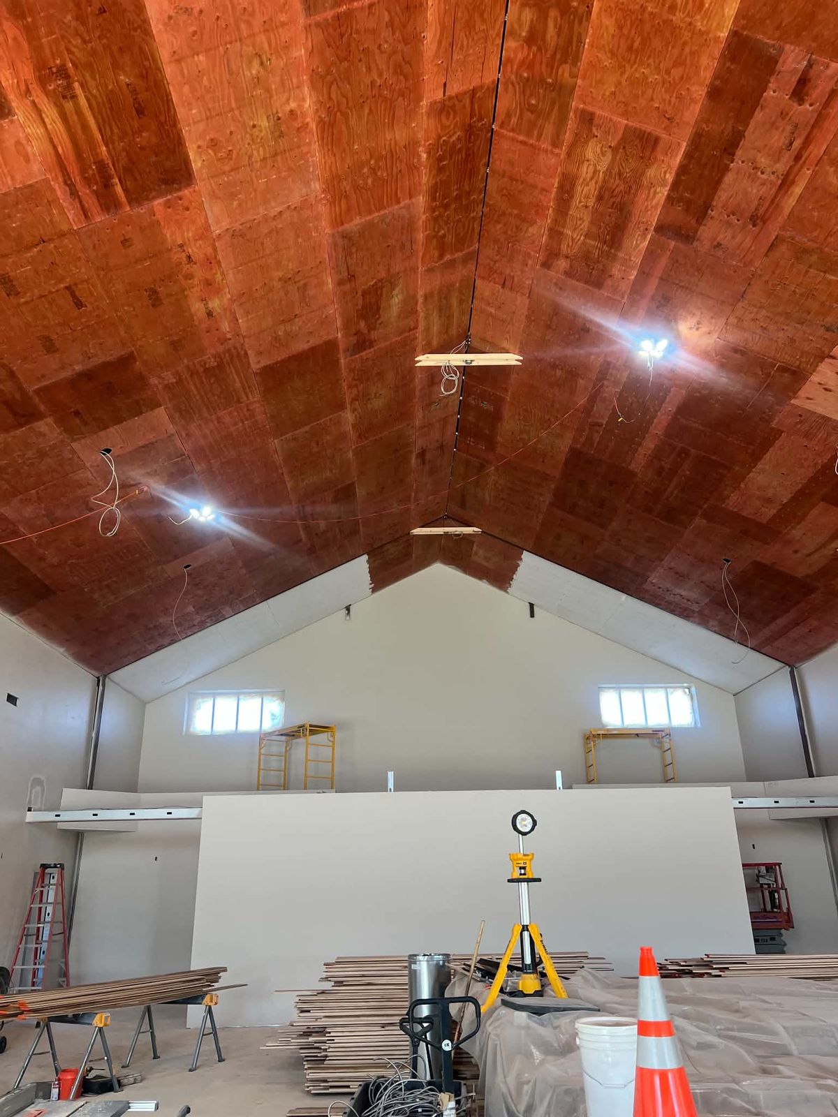 Before: bare plywood ceiling