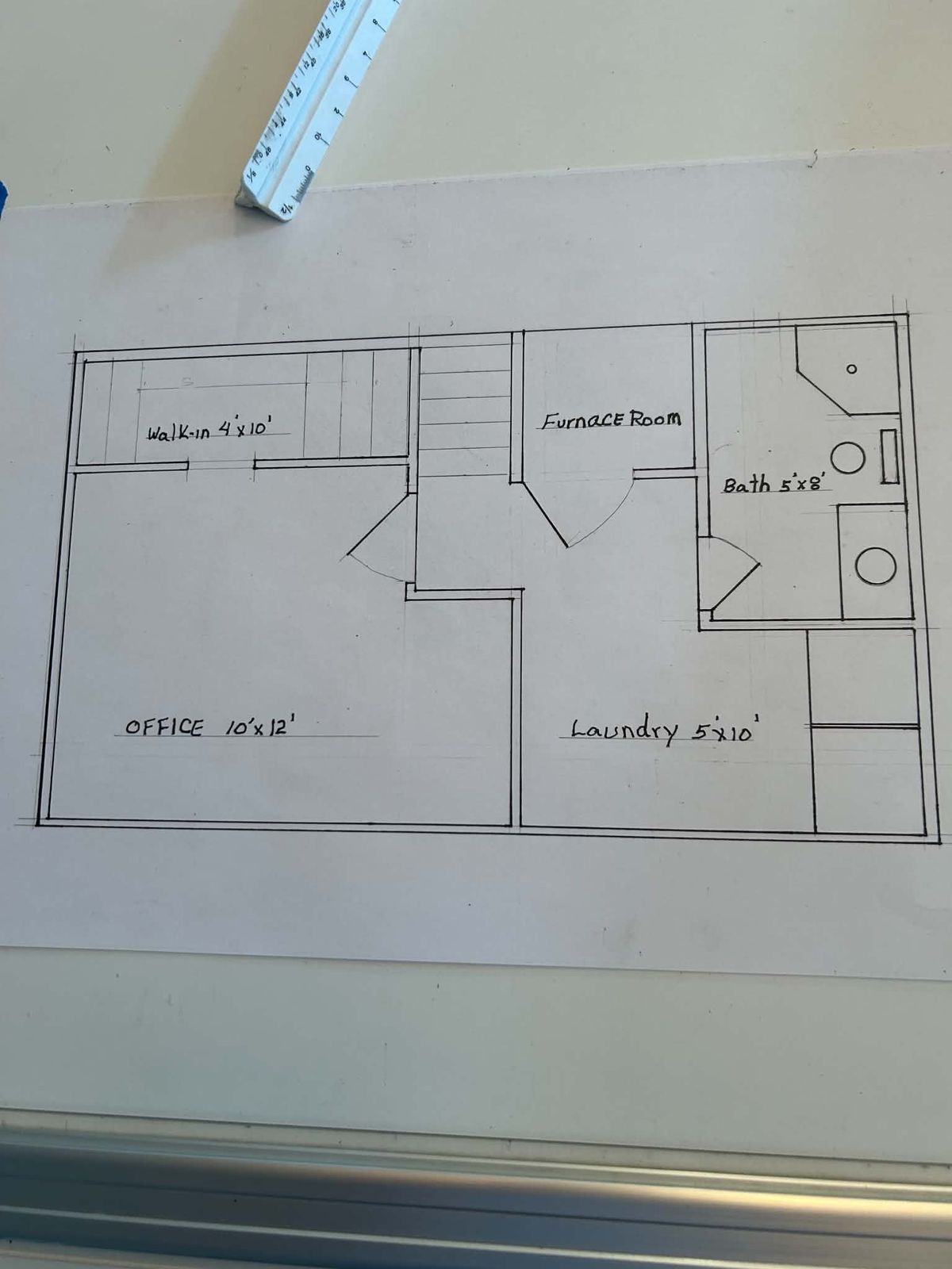 Hand-drawn floor plan with office, laundry, bath and furnace room